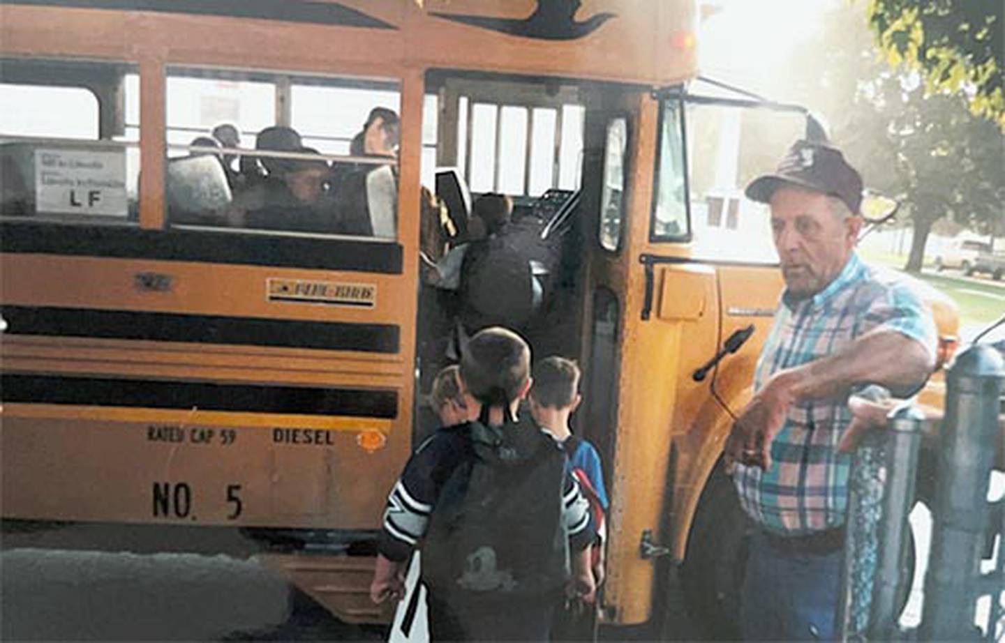 Darwin West monitors students boarding his bus at the Early Childhood Center during his long tenure as a daily route driver for the school district.