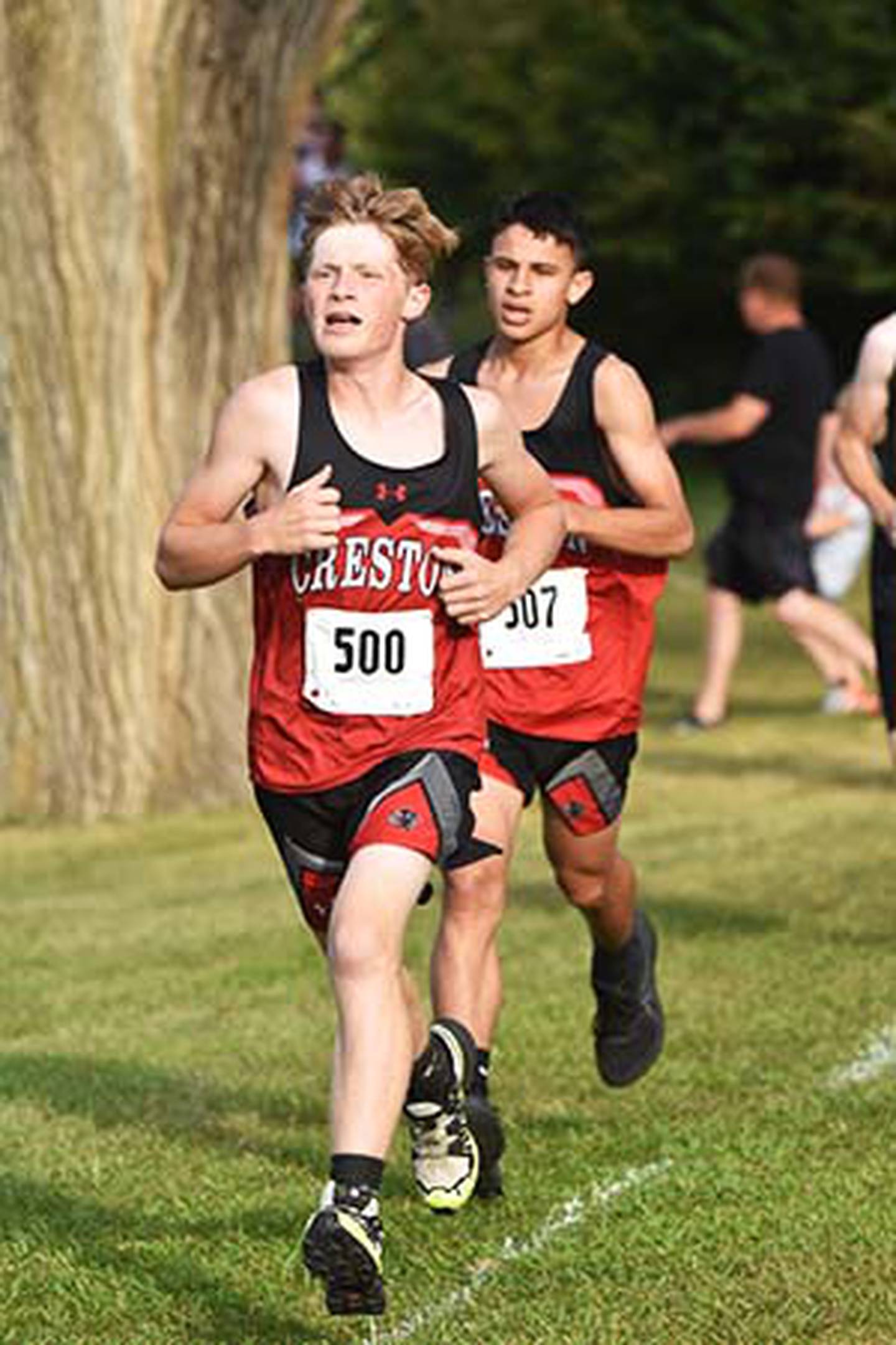 Allen Kendrick, front, and Hector Suazo run together. They finished 30th and 36th, the boys placing fourth.
