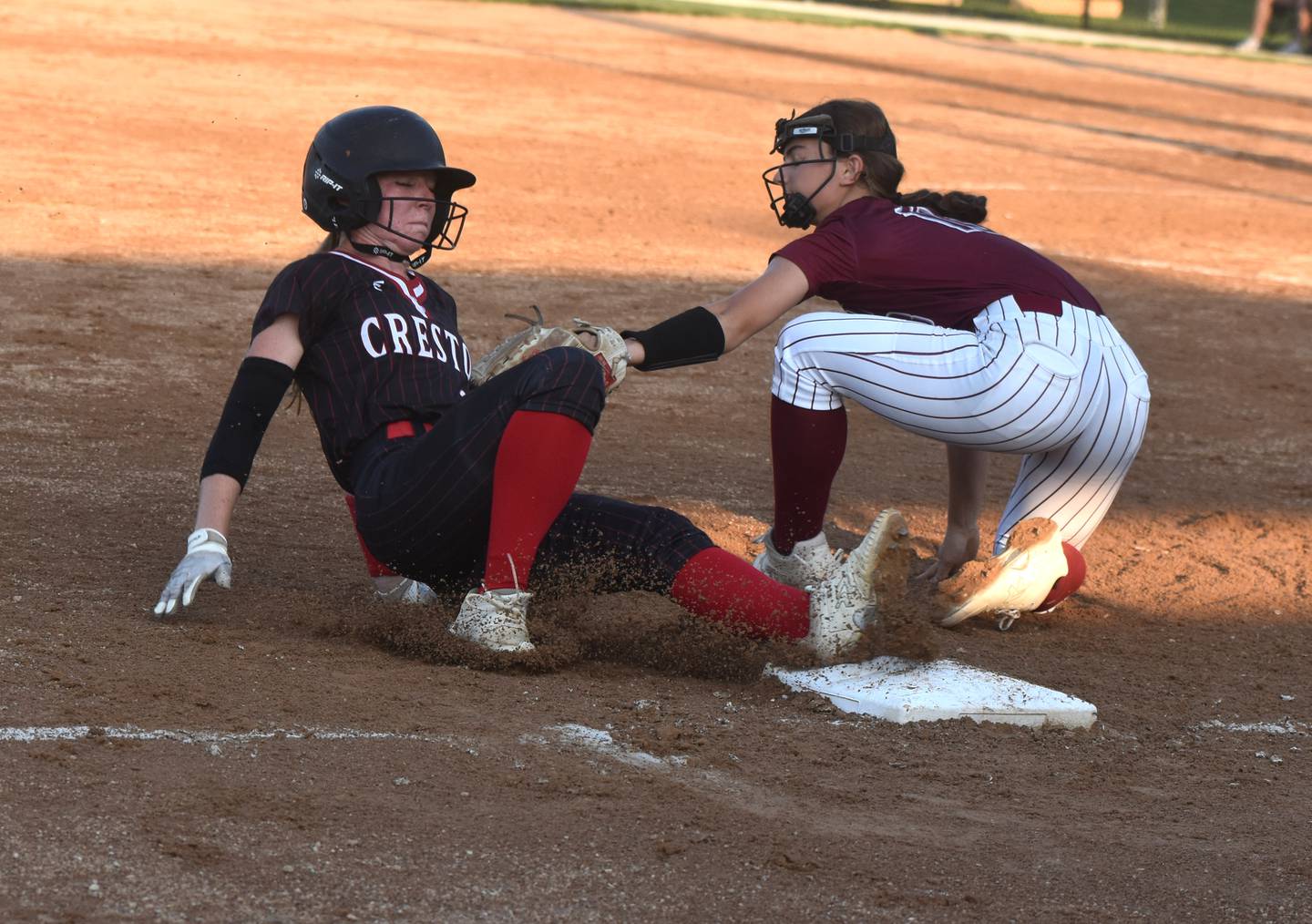 Avery Staver safely slides to third base.