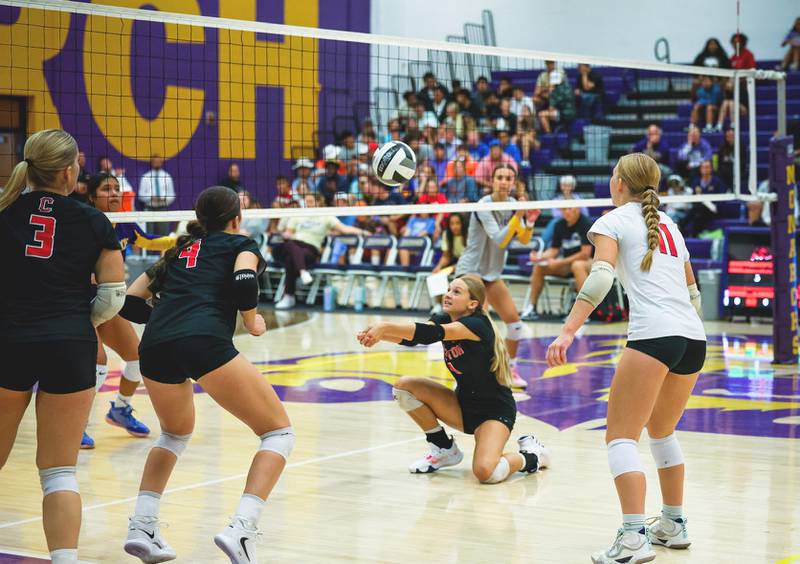 Senior Kadley Bailey goes to a knee for the ball Thursday in a 3-0 road win over Denison-Schleswig. Bailey had 30 assists against the Monarchs.