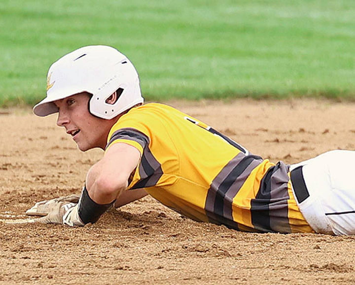 Gabe Funk slides safely for one of his 56 stolen bases in 56 attempts, which led the state in all classes. Funk, named to the Class 1A all-state first team, batted .427 and finished in the top six in 1A in singles (36) and runs scored (48).