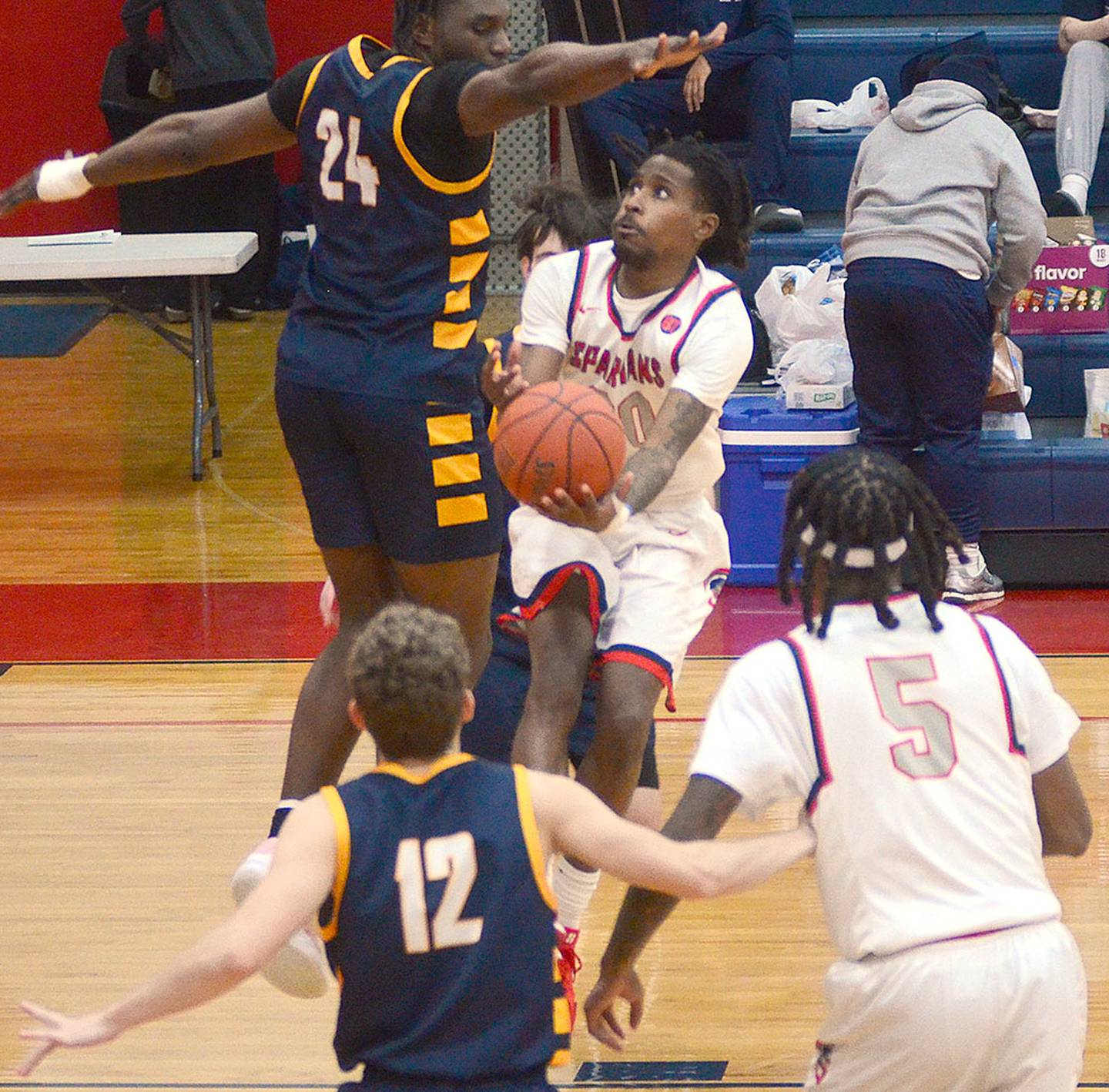 Myles Opare drives past an Iowa Lakes defender during Saturday's game. Opare contributed eight points, three steals and three assists to the 81-79 victory.