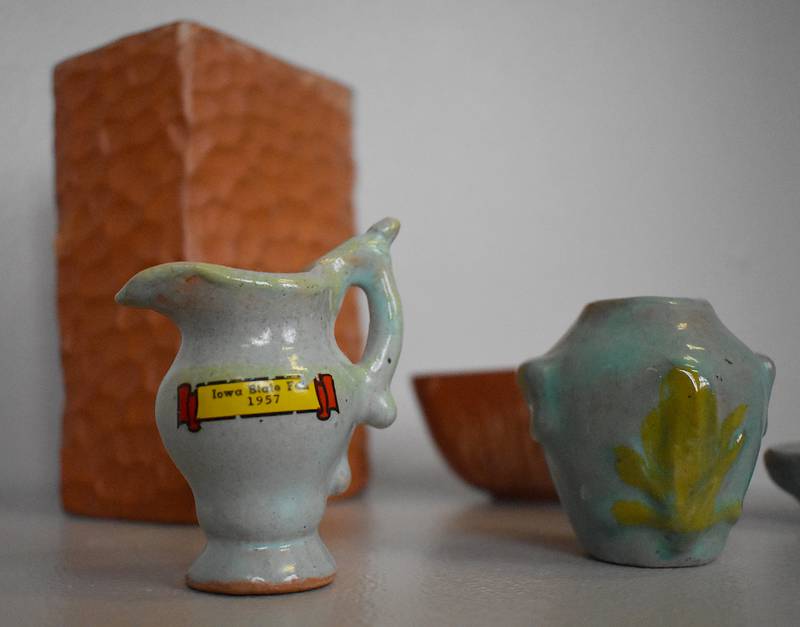 A small pot with an Iowa State Fair ribbon, dated 1957.