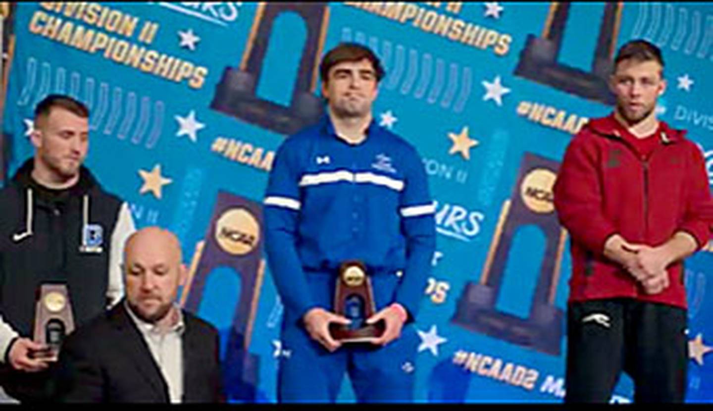 Jackson Kinsella of Nebraska-Kearney is on the medal stand after receiving his third-place award at 197 pounds.
