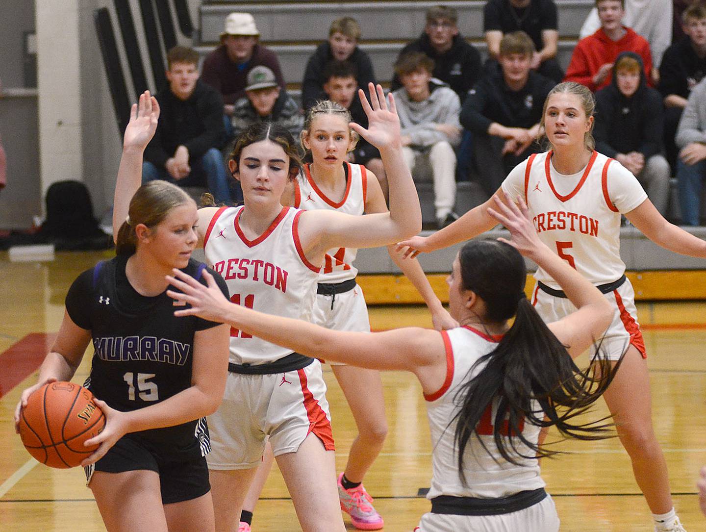 Maliya Berry of Murray (15) is surrounded by Creston defenders Monday. Shown from left are Kinzley Downing, Bentleigh Collier, Marlee Stalker and Hope Henderson. Berry led Murray with nine points.
