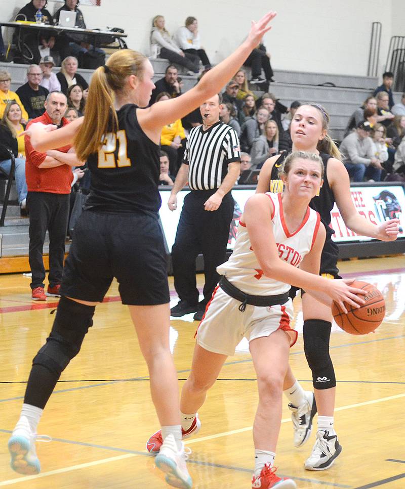 Creston's Ella Turner splits two Winterset defenders on her way to the basket. Turner scored seven points in the 55-40 loss Monday.