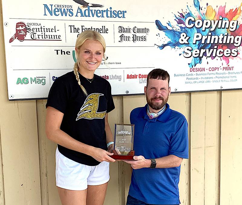 Lenox Tigers standout Sadie Cox (left) receives the 2025 South Central Iowa Female Athlete of the Year Award from Adair County Free Press editor Caleb Nelson.