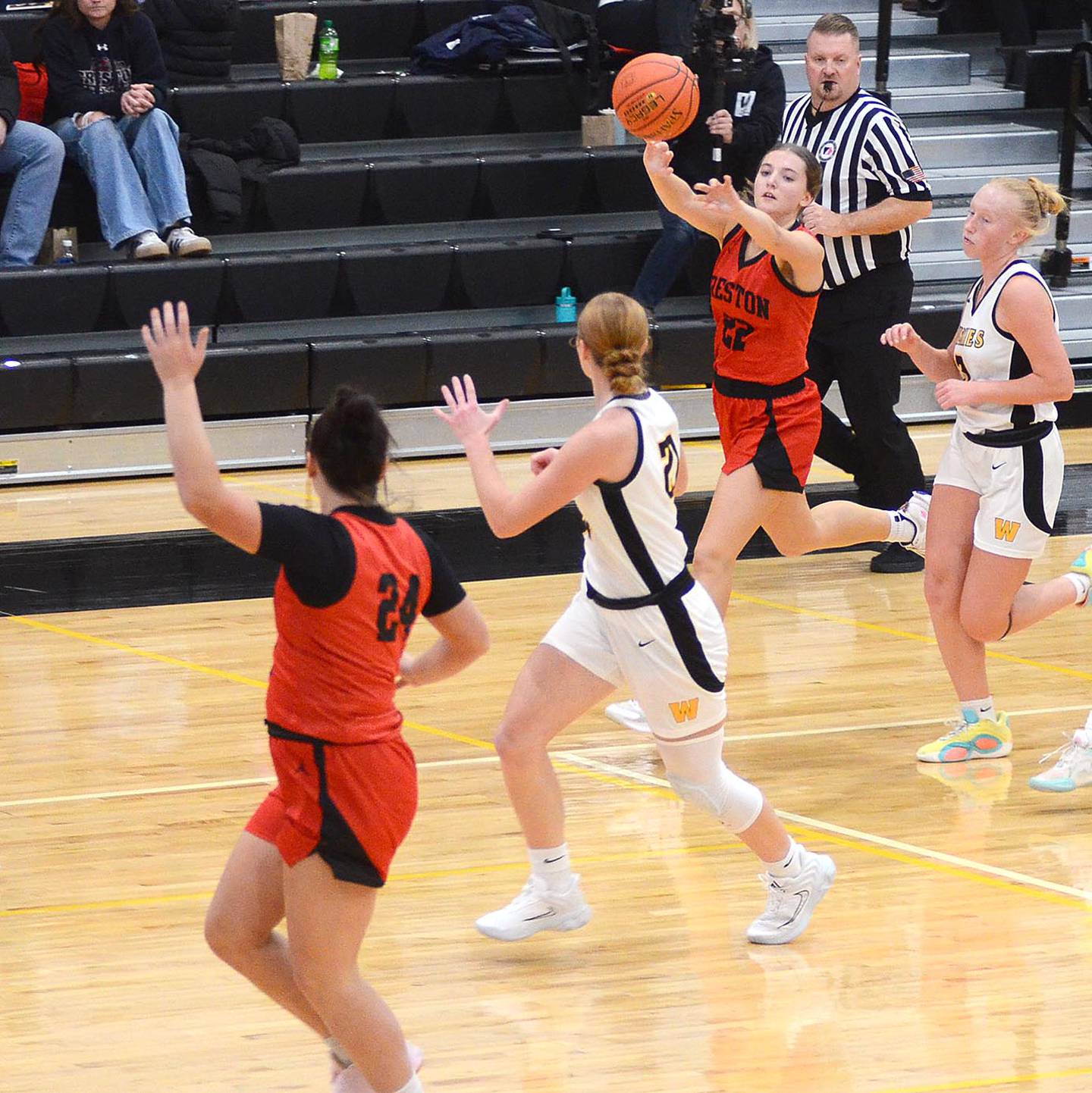 Creston senior Ady Morrison passes ahead to teammate Kennedy Strider on a Panther fast break during Monday's game. Morrison scored three points and grabbed four rebounds in the loss to Winterset.