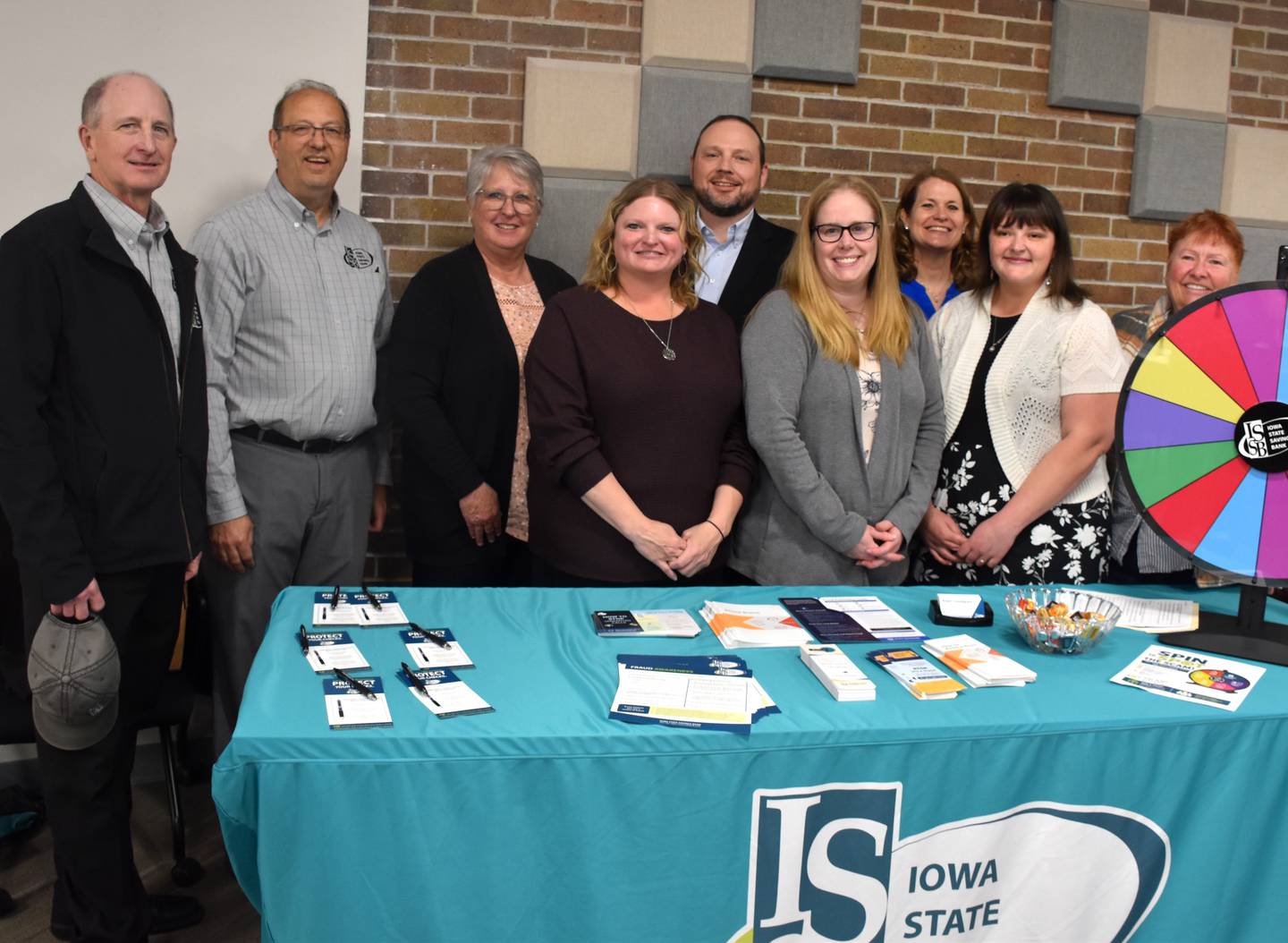 Staff at Creston's ISSB share information and goodies at the fraud seminar.