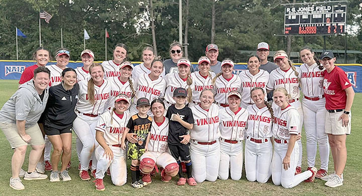 The Grand View softball team is shown after defeating the tournament's No. 1 seed, Cumberlands (Kentucky), 2-0, at the NAIA World Series in Columbus, Georgia. Nevaeh Randall of Creston is third from right, standing. Head coach Lou A. Yacinich is off her right shoulder in back.