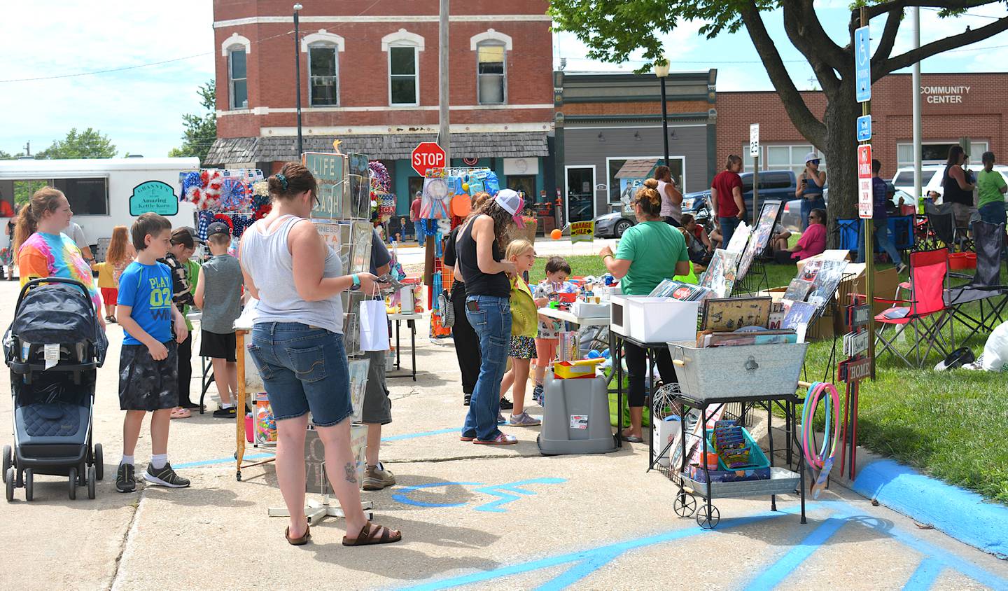 Shoppers visit vendors around the Afton square during the 2024 Pre Fourth Celebration