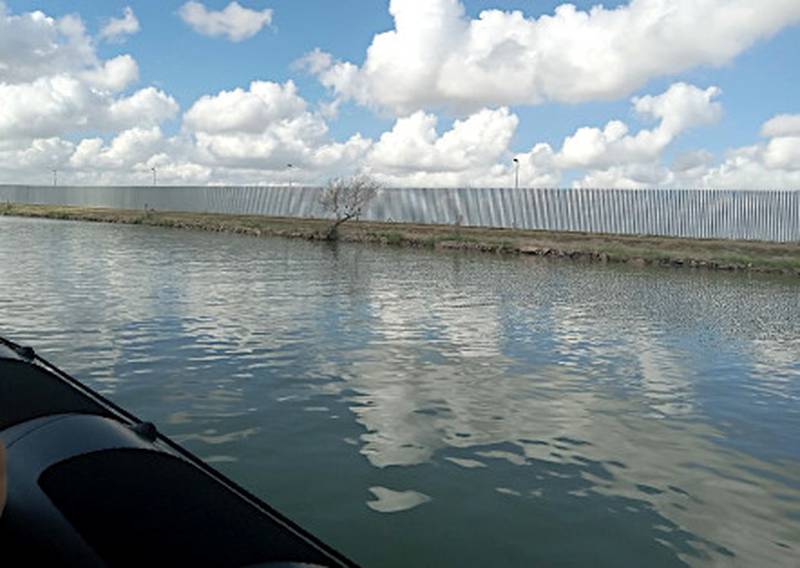 A portion of a border wall along the Rio Grande River divides south Texas from Mexico. Iowa State Sen. Tom Shipley toured the area in late September.