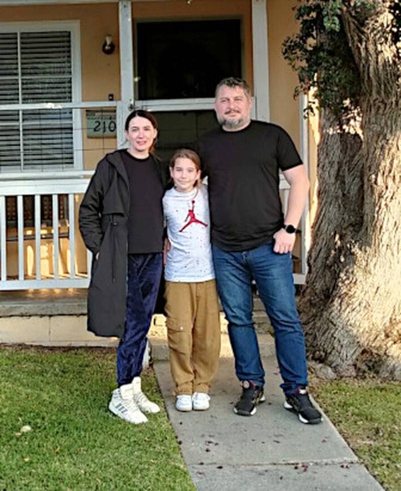 From left to right, Lesia, Eliza and Roman Nikitienko, in front of their rental house at St. Paul’s Methodist Church in North Redondo Beach. The family’s hometown is where the “Bucha massacre” occurred in the first weeks of the Russian invasion of Ukraine.