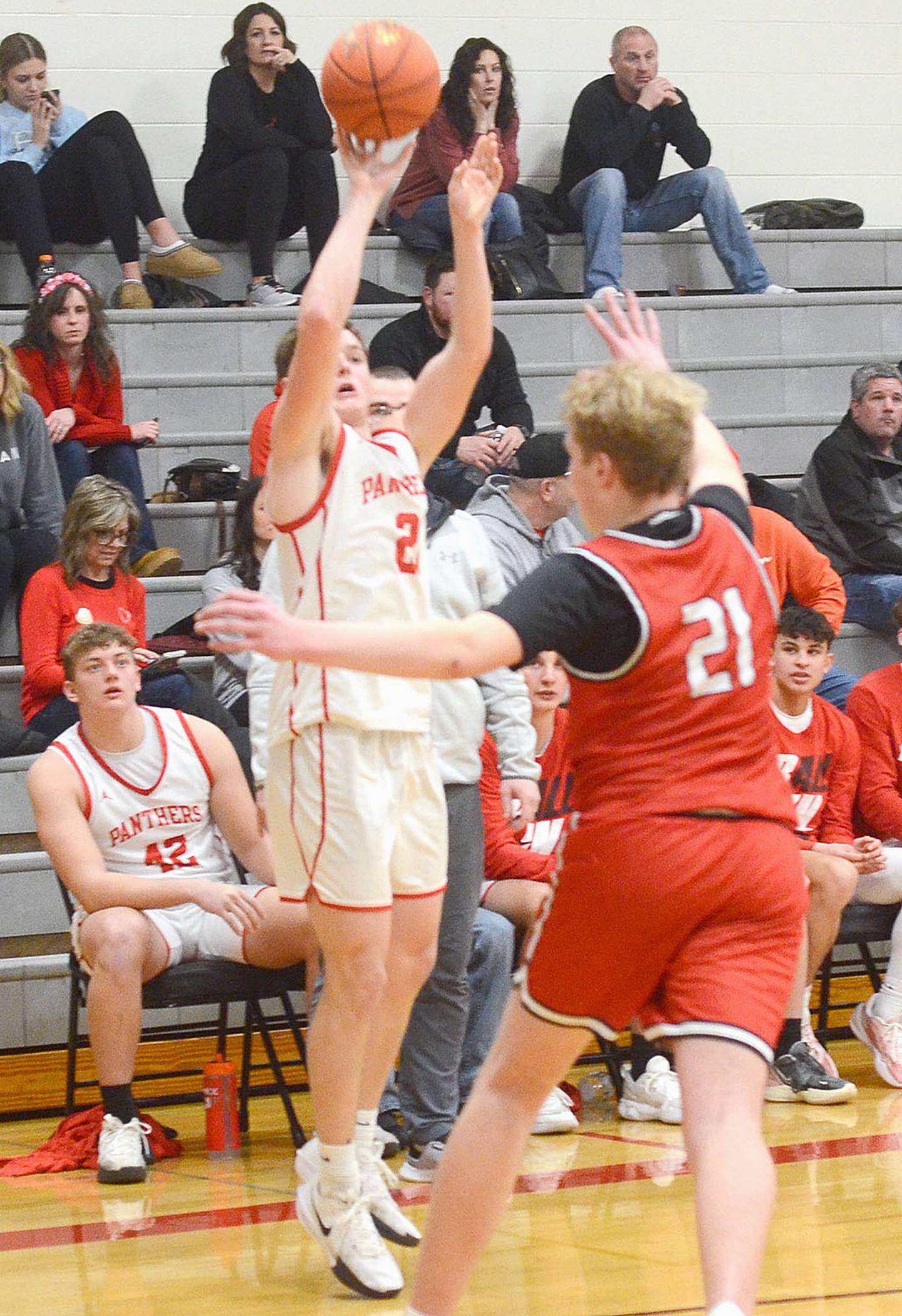 Josh Schaefer of Creston shoots a 3-pointer against Harlan Friday.