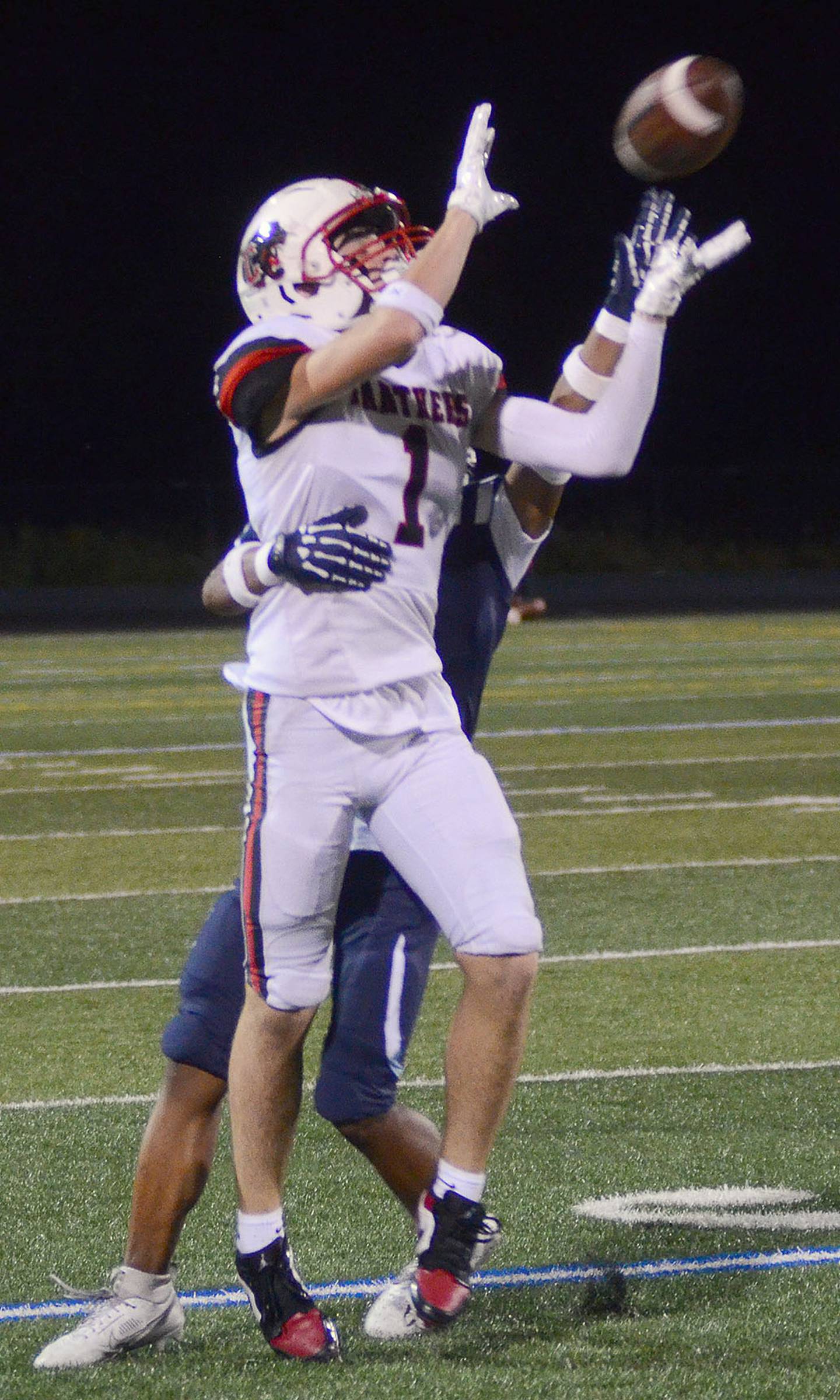 Jace Purdum of Creston (1) receives a pass from Tanner Ray during Friday's game. Purdum caught eight passes for 119 yards and one touchdown.