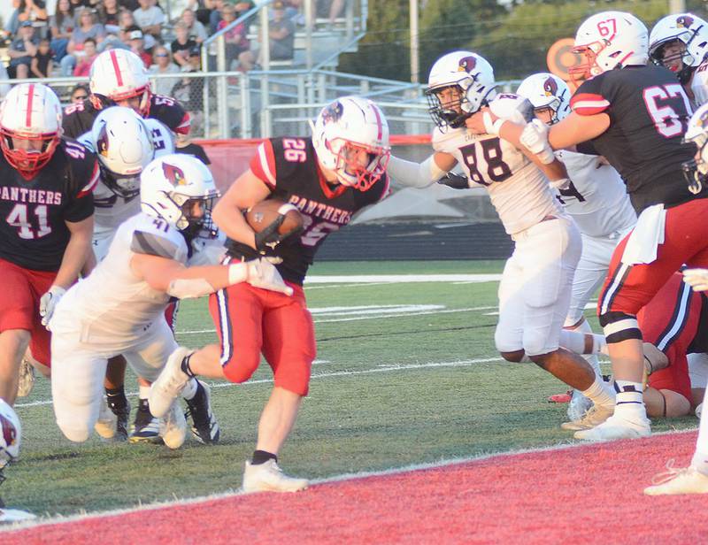 Creston running back Jackson Pettegrew scores the first of his two short-yardage touchdowns in Friday's 35-21 loss.