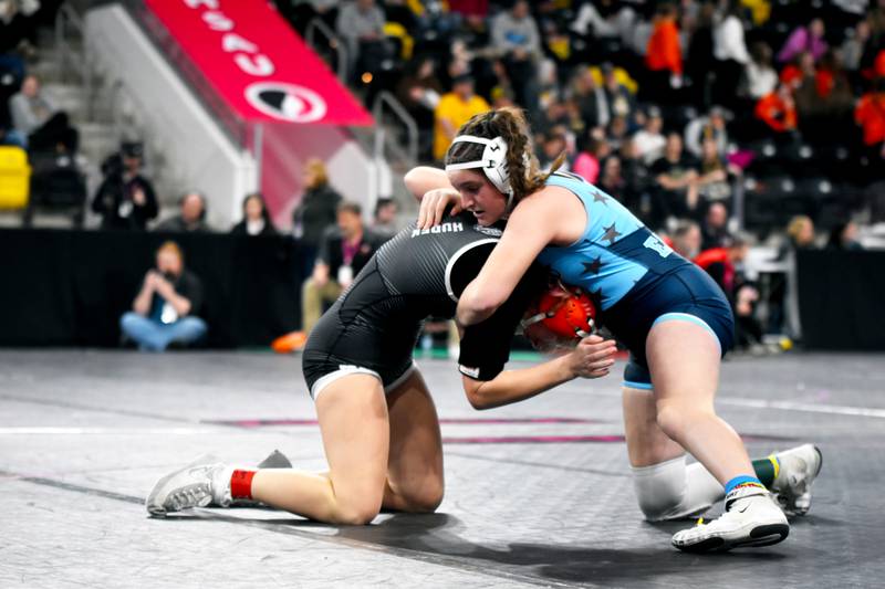 East Union's Cheyenne Dike, right, competes at the 2024-25 girls state wrestling meet. Dike was one of five Eagle wrestlers to qualify for the event, two girls and three boys.