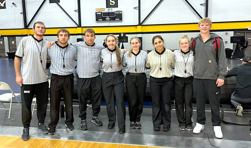 Fourth from left, Nodaway Valley alum Grace Britten has found a niche as a wrestling official, while also studying at Wartburg College and being a part of their women's wrestling program. From left are Wartburg men's and women's wrestlers who are also officiating: Brody Lee, Carter Martinson, Carson Martinson, Britten, Annabel Blanchard, May Prado, Gable Hemann and Hesston Johnson.