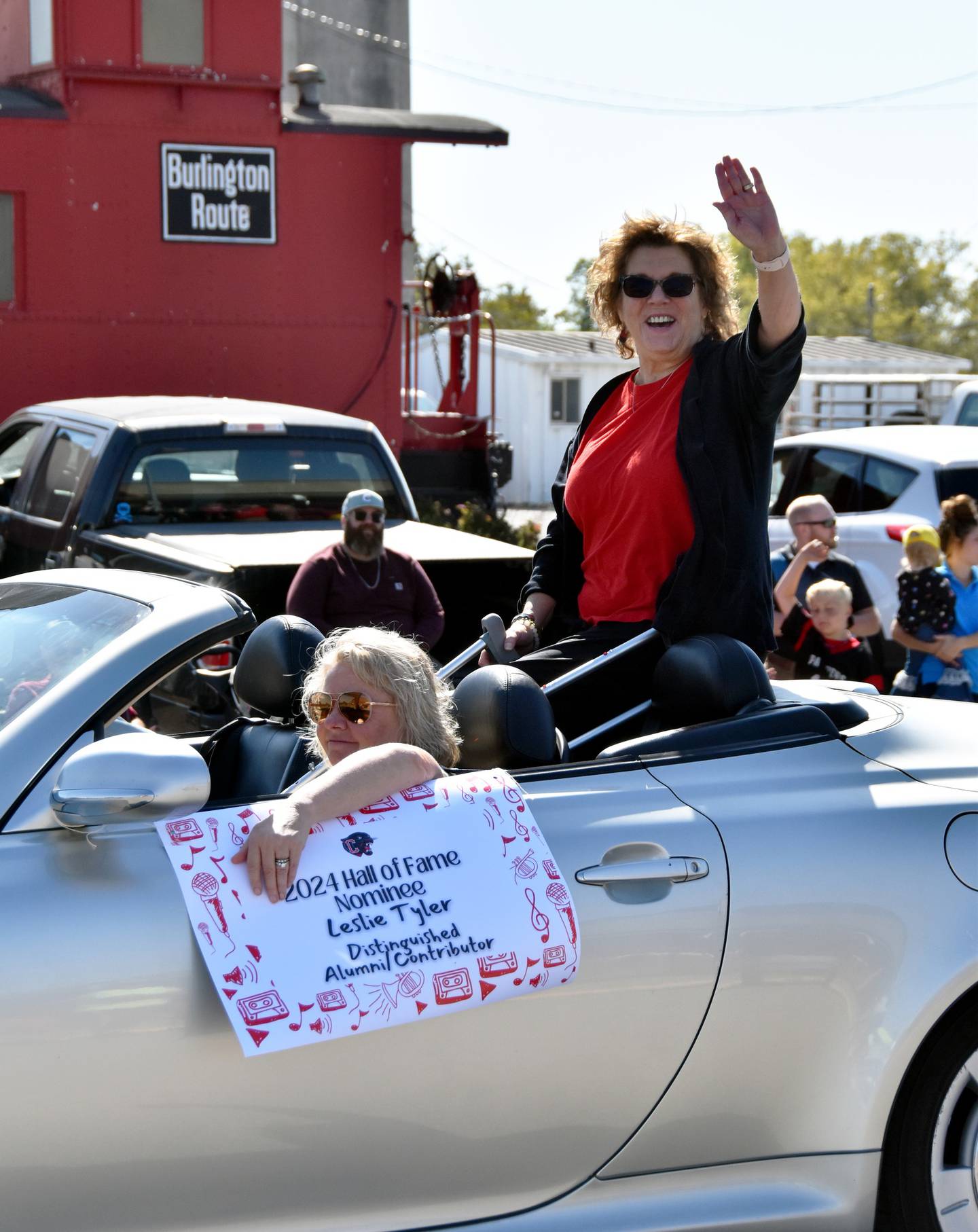 Creston Hall of Fame inductee Leslie Tyler smiles at the camera during the homecoming parade.