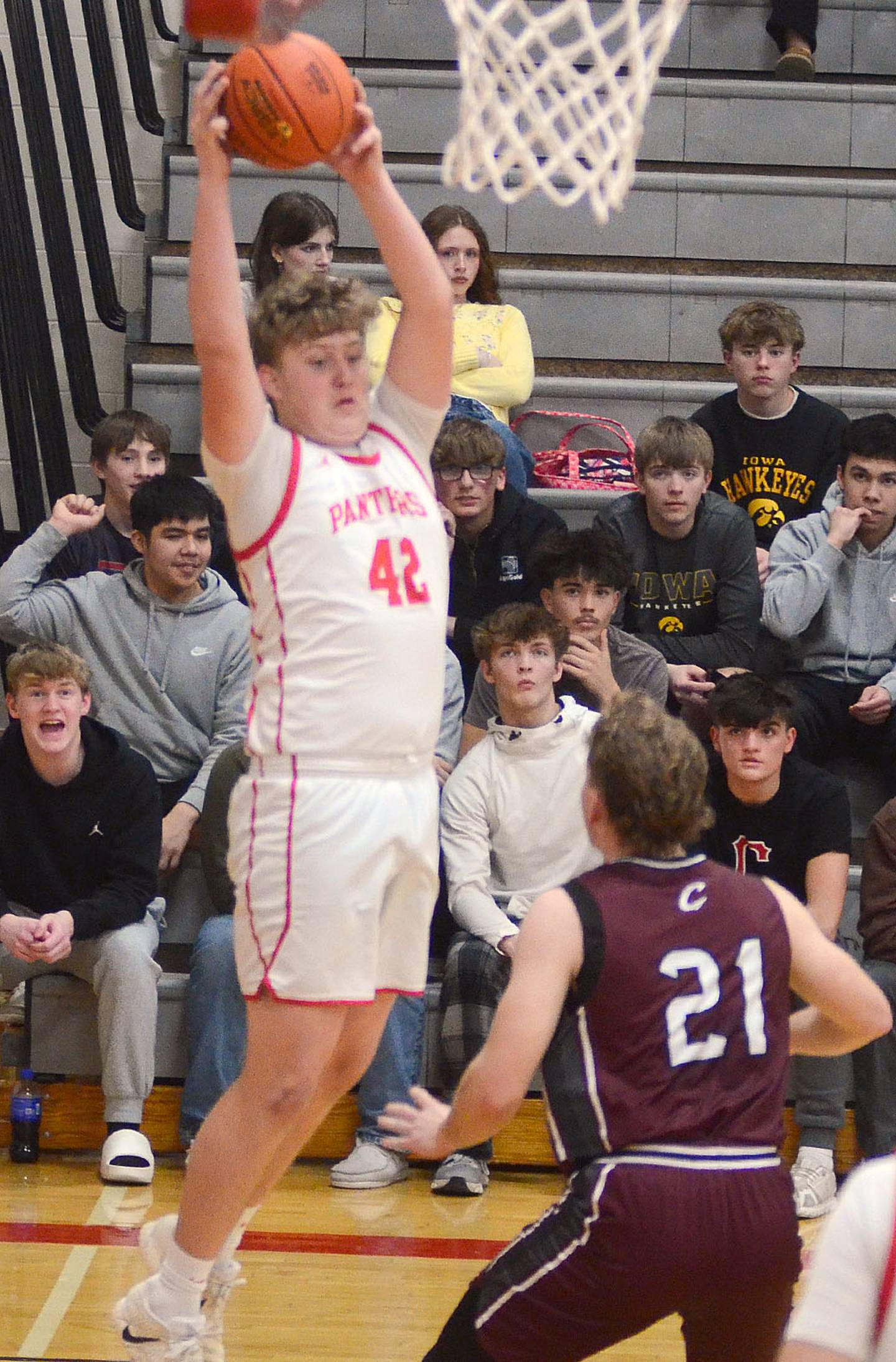 Layne Sand of Creston (42) grabs a defensive rebound Monday.