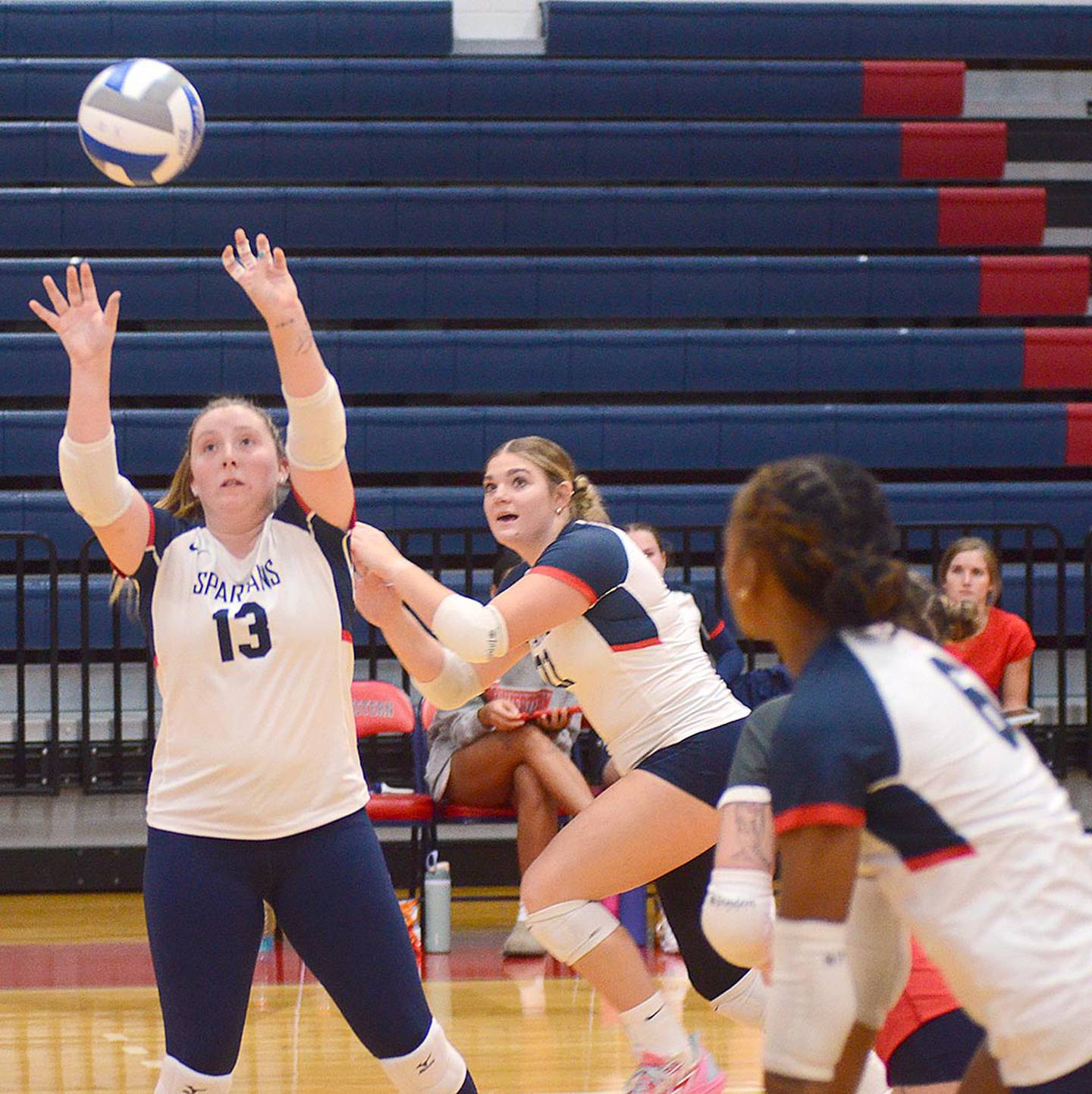 Cadence Perkins (13) sets for attacker Skyelar Lawal (6) as Danyelle Steinkuehler sets up on the back side. Lawal had 10 kills.