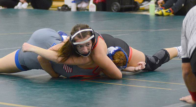 Alainah Galanakis of Creston looks toward the official as she's about to be awarded a win by fall in the 130-pound semifinals at Woodward-Granger Friday. Galanakis also won by fall in the finals to win the championship.