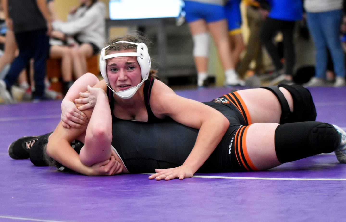 Zoey Vandevender (135) holds Joselyn McCunn of Red Oak to the mat for a third-period pin to advance to the finals Monday at the Valkyrie Open at Nodaway Valley. Vandevender won her weight class. Highway 34 won the tournament by four points over S.W.A.T.