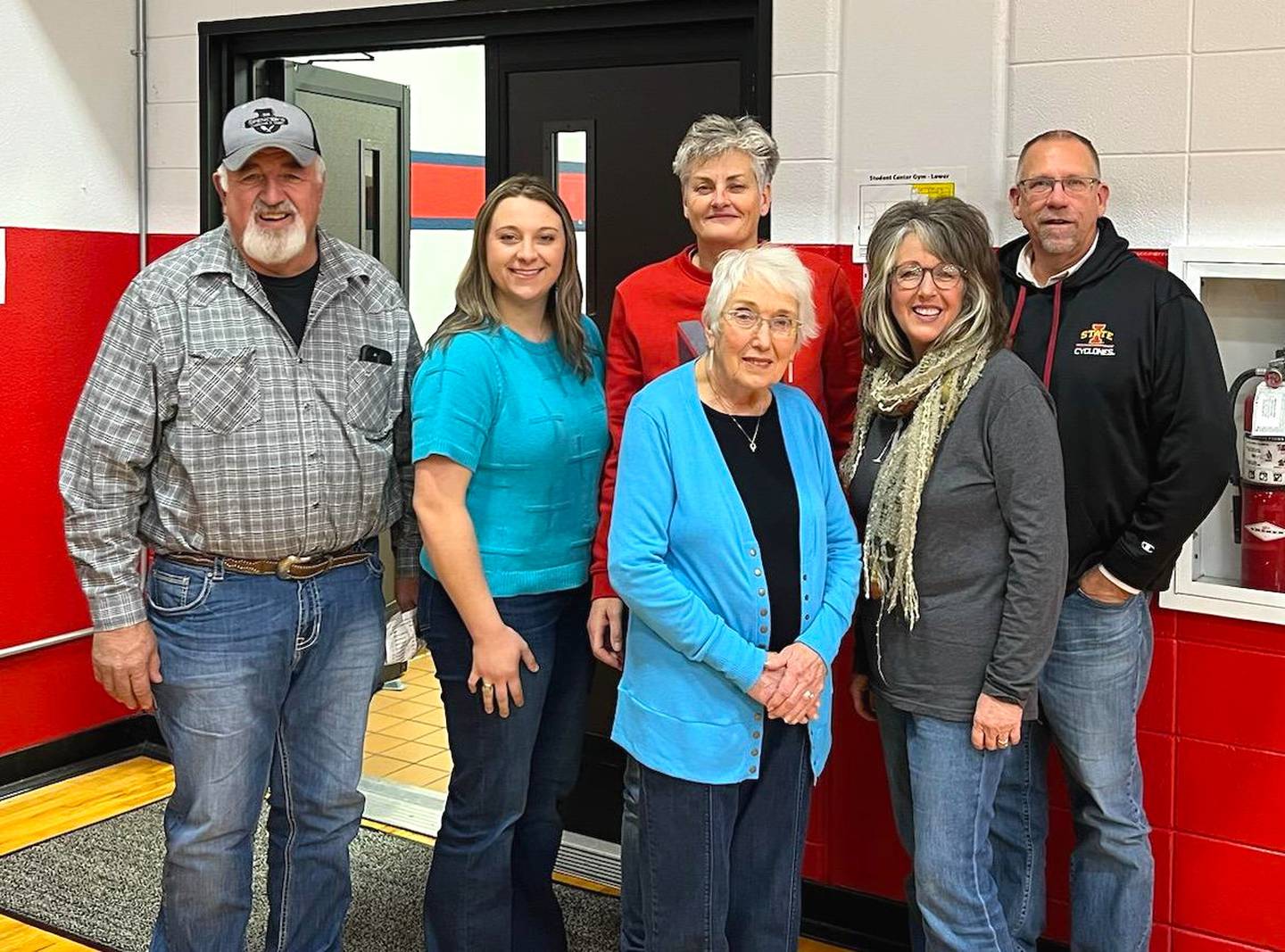 DeBruin poses with members of her high school host family during her December visit to Iowa.