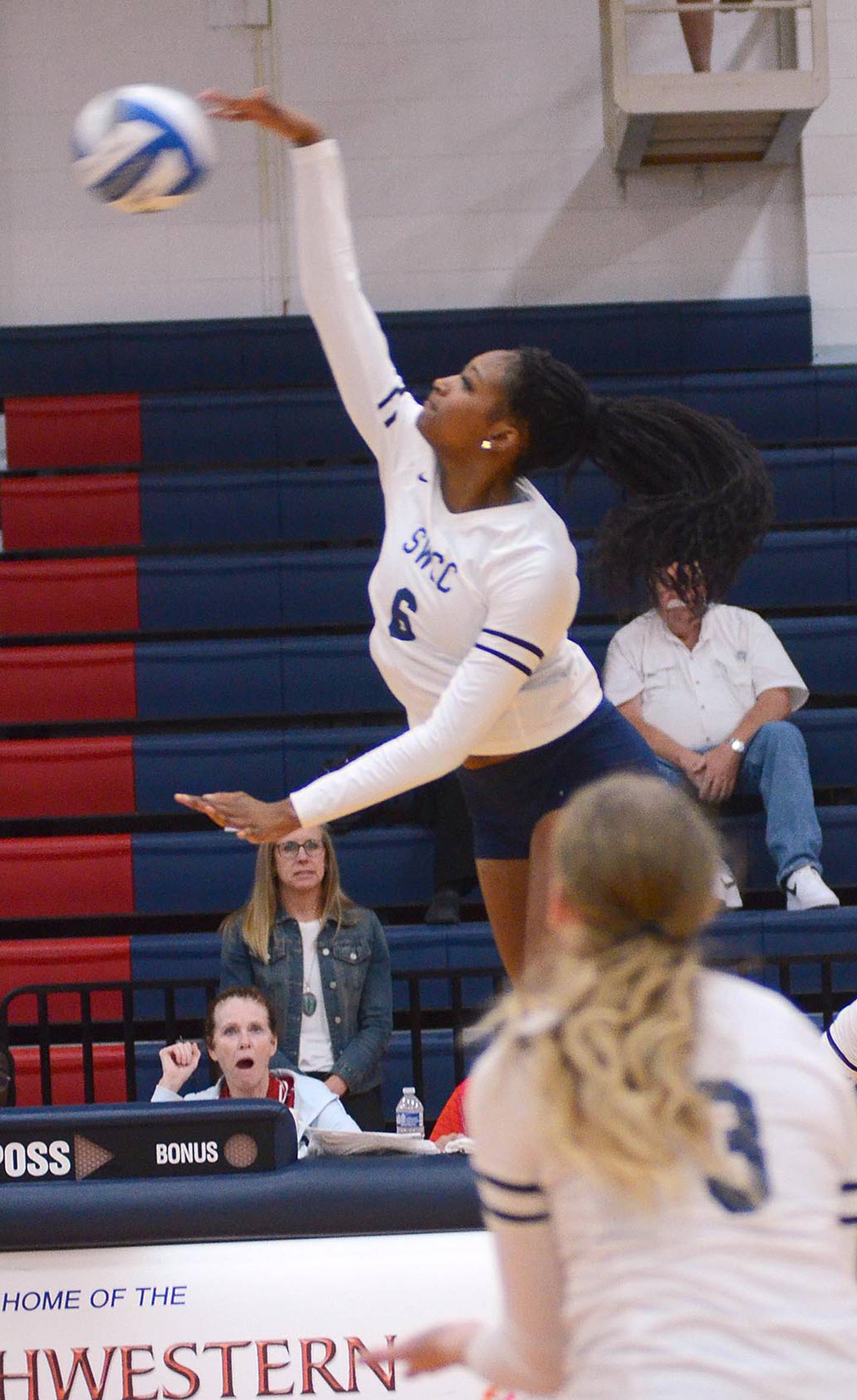 Southwestern's Skelar Lawal sends an attack into the Western Iowa Tech court during Wednesday's home match.
