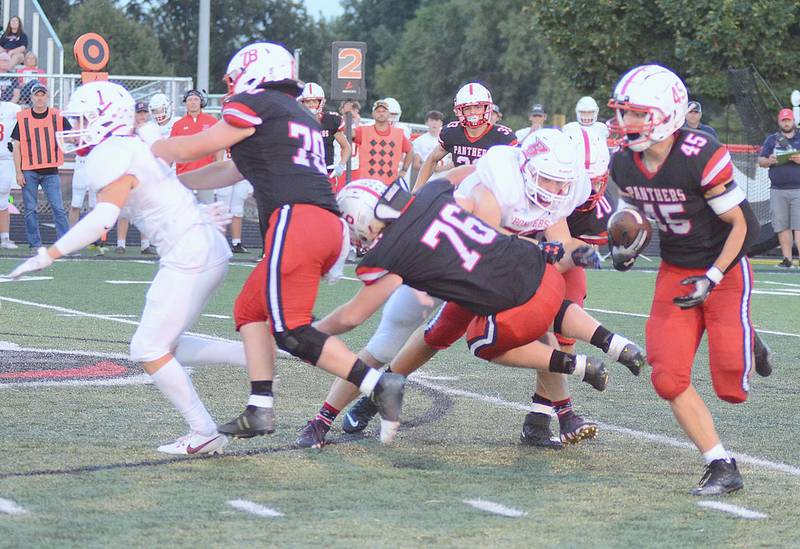 Creston running back Brennan Hayes (45) runs behind blockers Quinten Fuller (70) and Gunner Martwick (76) on a 67-yard touchdown reception Friday. Hayes had 307 yards in total offense and five touchdowns, receptions and rushing.