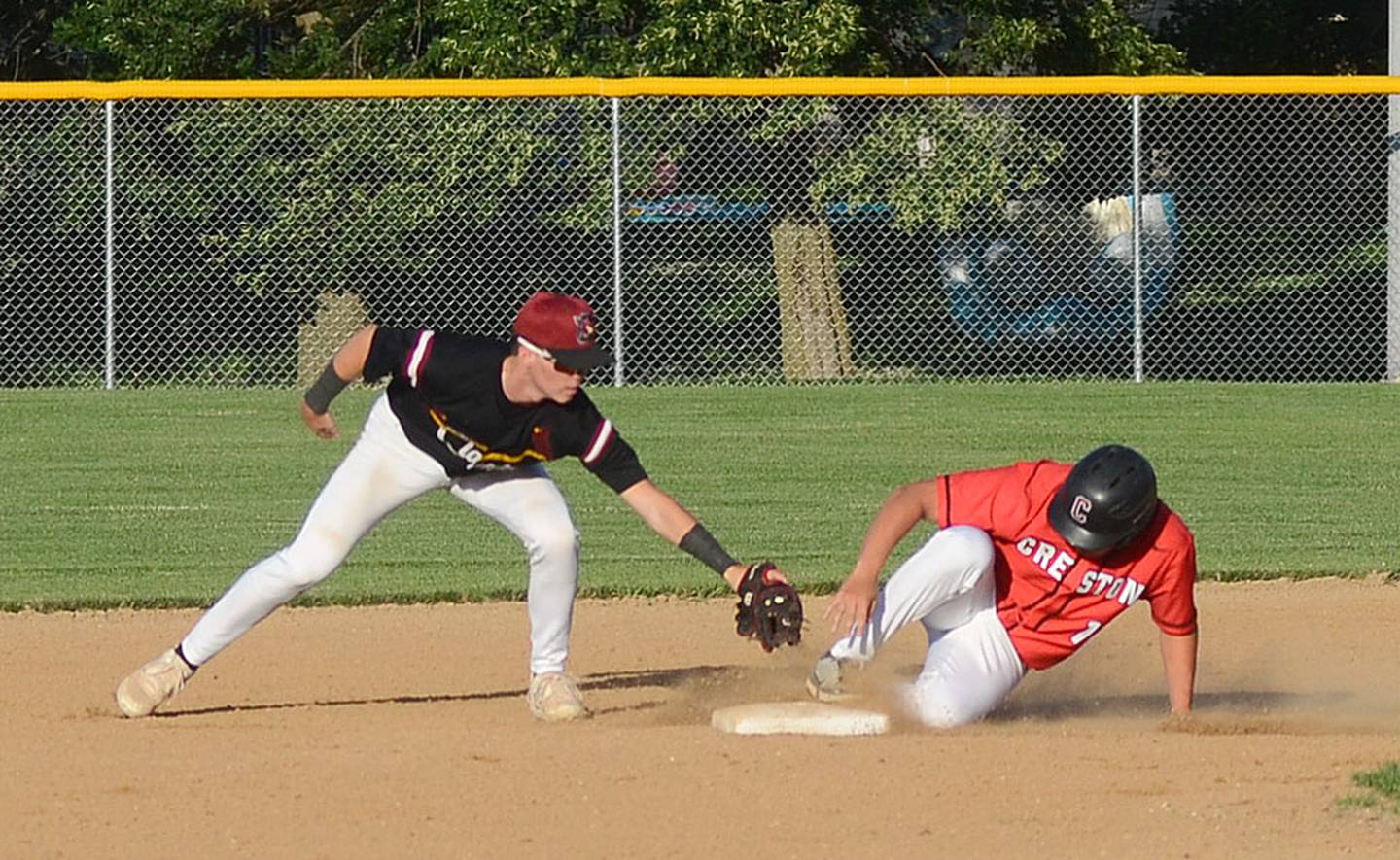 Mattias Schultes slides safely into second base after na run-scoring hit in the second inning against Clarinda Friday.