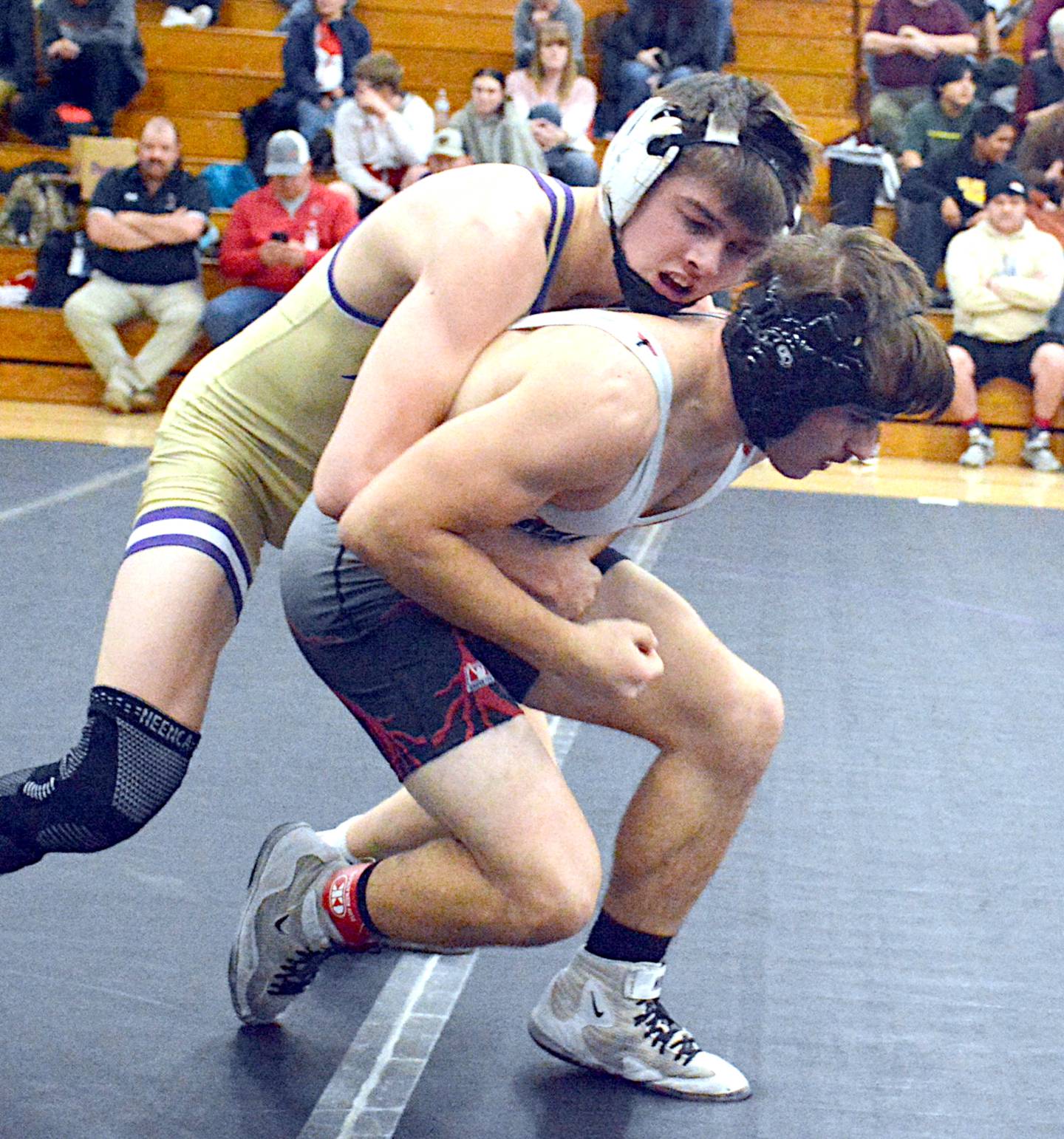 NV's Ty Strode catches Mount Ayr's Bryson Martin for a takedown in their championship match at the Coach Riley Invitational.
