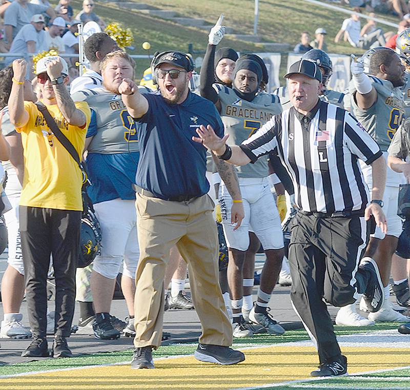 Graceland University student coach Chris Wilson of Creston reacts to a completion near the goal line during the Yellowjackets' home victory over Peru State earlier this month. Wilson began as an offensive lineman for Graceland before retiring as a player due to a knee injury.