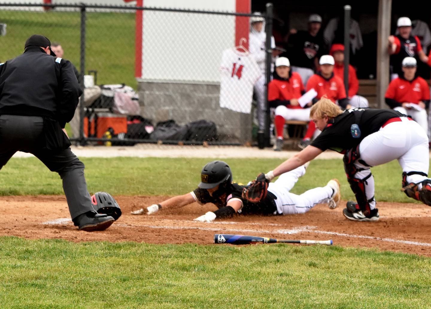 Creston catcher Tom Mikkelsen tags a Winterset runner out before he's able to reach home plate.