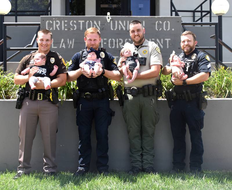 Local law enforcement welcomed four new babies, all born at Greater Regional Health, to their families over 10 weeks. From left, Iowa State Trooper Kaden Bolton with Lance, Officer Nicholas Perry with Lilah, Sergeant Dillon Hightshoe with Lucy and Sergeant Patrick Roche with Eliza. In just June, the hospital brought 25 babies into the world.