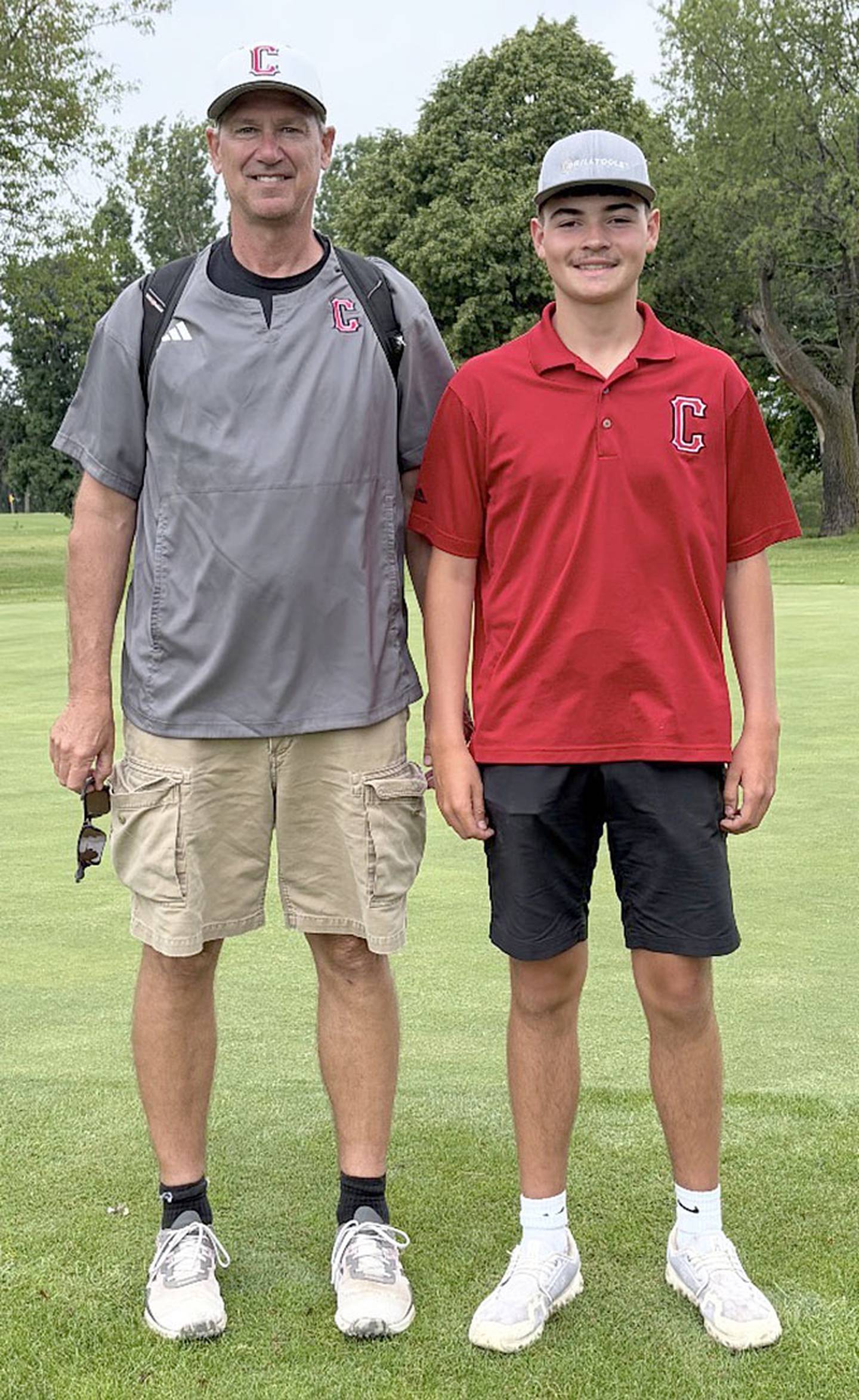Creston coach Steve Shantz (left) and district qualifier Branden Spencer.