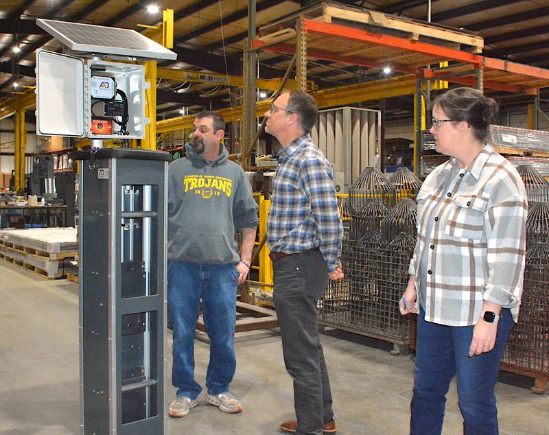 Agri Drain Plastics Supervisor Terry Chaney, President Scott Lukan and Business Support Manager Lisa Newby display one of their SDS 1000 units last week at Agri Drain.