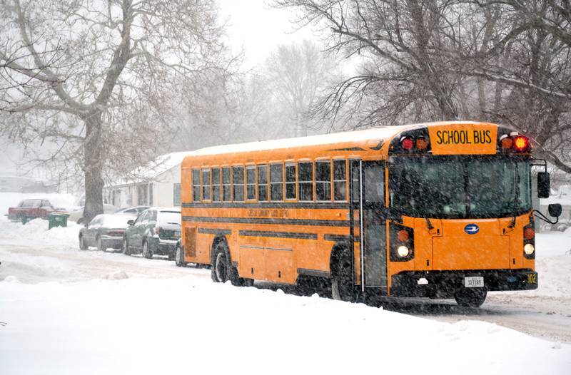 A school bus drops children off after school on Thursday. Superintendent Deron Stender is working with the county in the hopes of making school bus routes a priority after large snow storms.