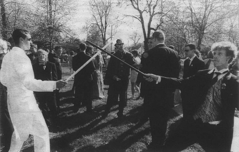 Cole Kralik, left, and Jason Hyde begin the afternoon with a duel in Rainbow Park. Could it be a fight to the finish for a prom date?