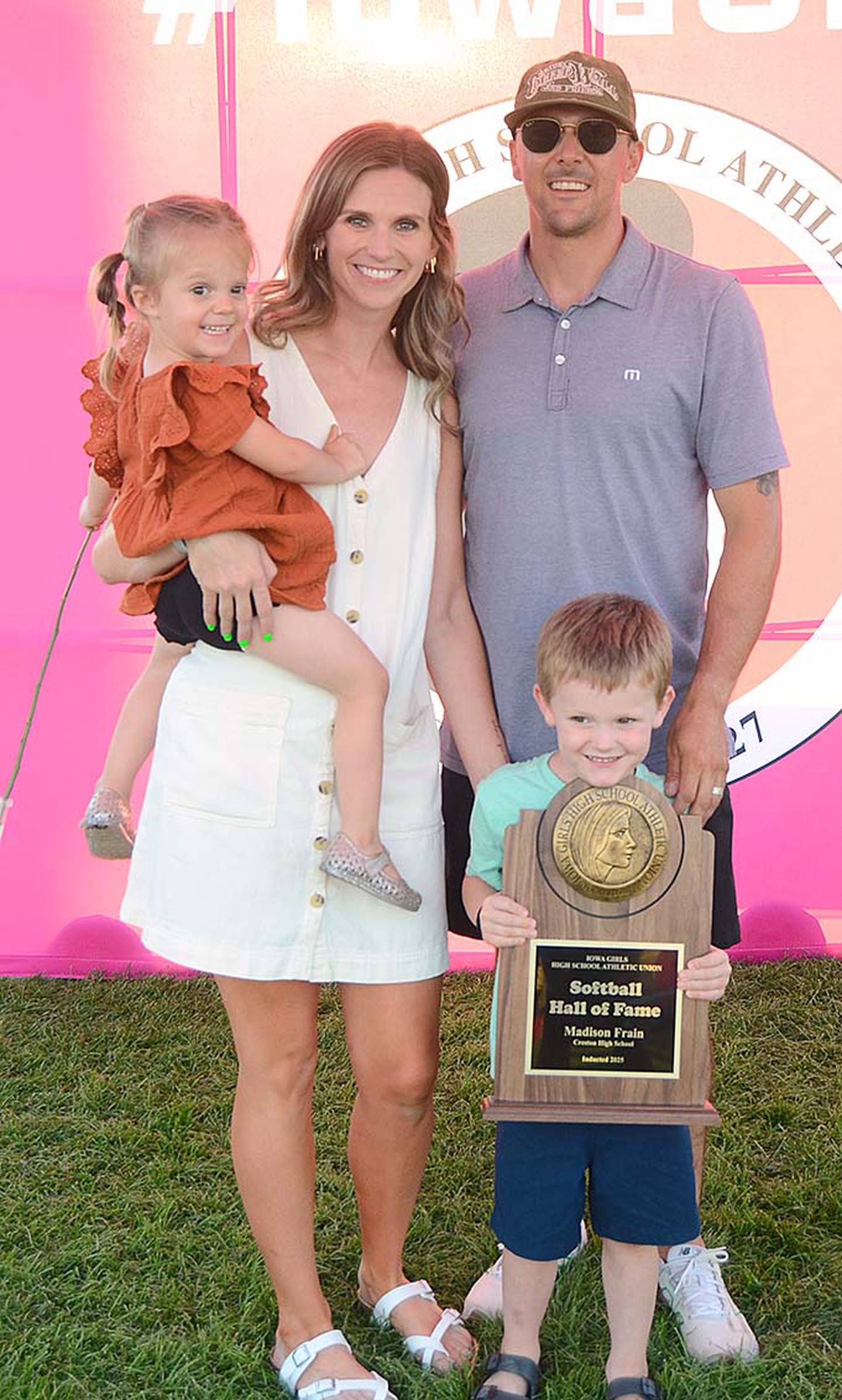 Hall of Fame inductee Madison (Frain) Peterson is shown with husband Zach and children Johnny, 5, and Lucy, 2, after Thursday's award ceremony.
