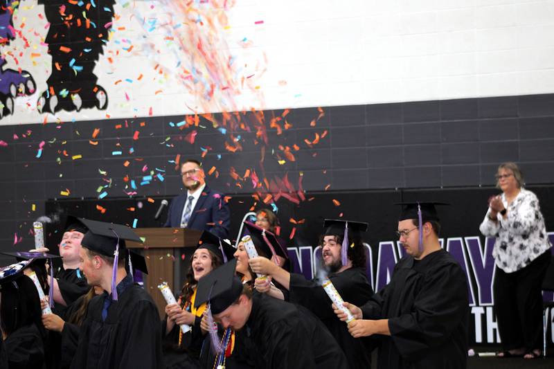 Nodaway Valley and Orient-Macksburg seniors release confetti upon the conclusion of the commencement exercises ceremony Sunday, May 17.
