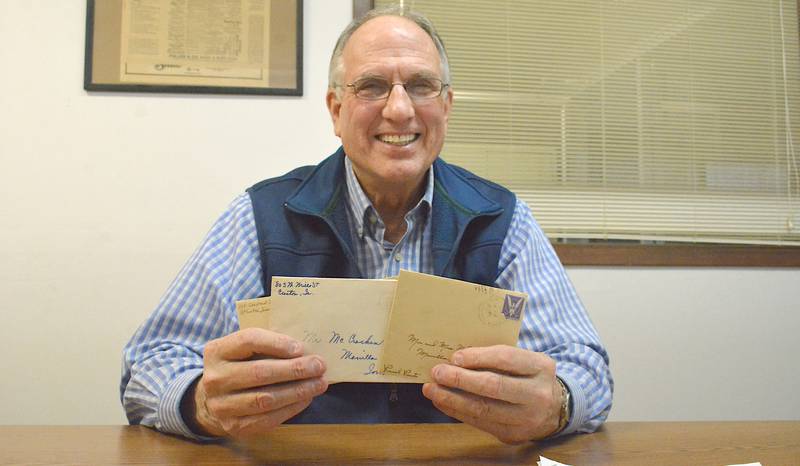 Jim McCracken holds three letters he found which were sent to his grandparents. These letters have been the subject of Jim's journey to track down a part of his family's history.