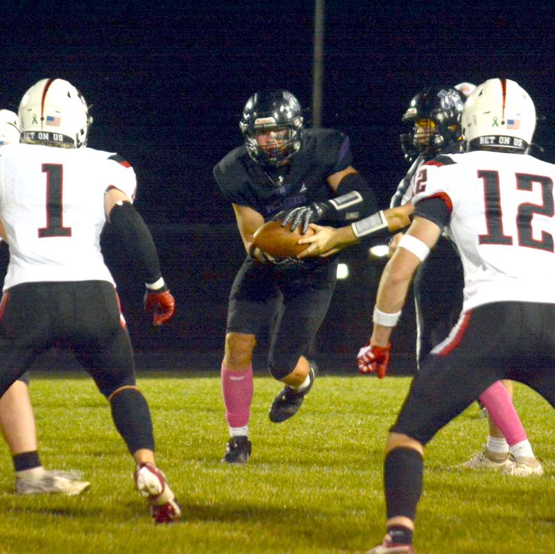 NV/OM junior Caleb Christensen receives the handoff with plenty of a running lane during last Friday's football game against Mount Ayr.