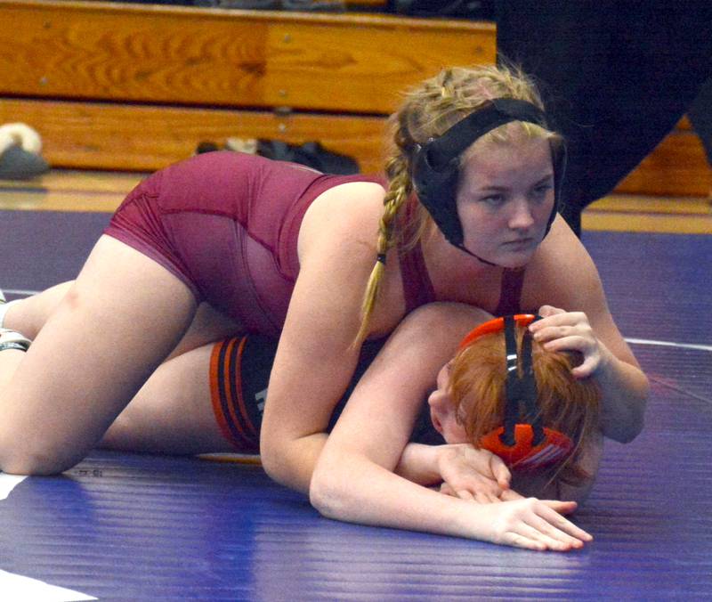 SWAT's Addy Erlandson puts pressure on her Red Oak opponent's head during a match in Anita Thursday, Nov. 20.