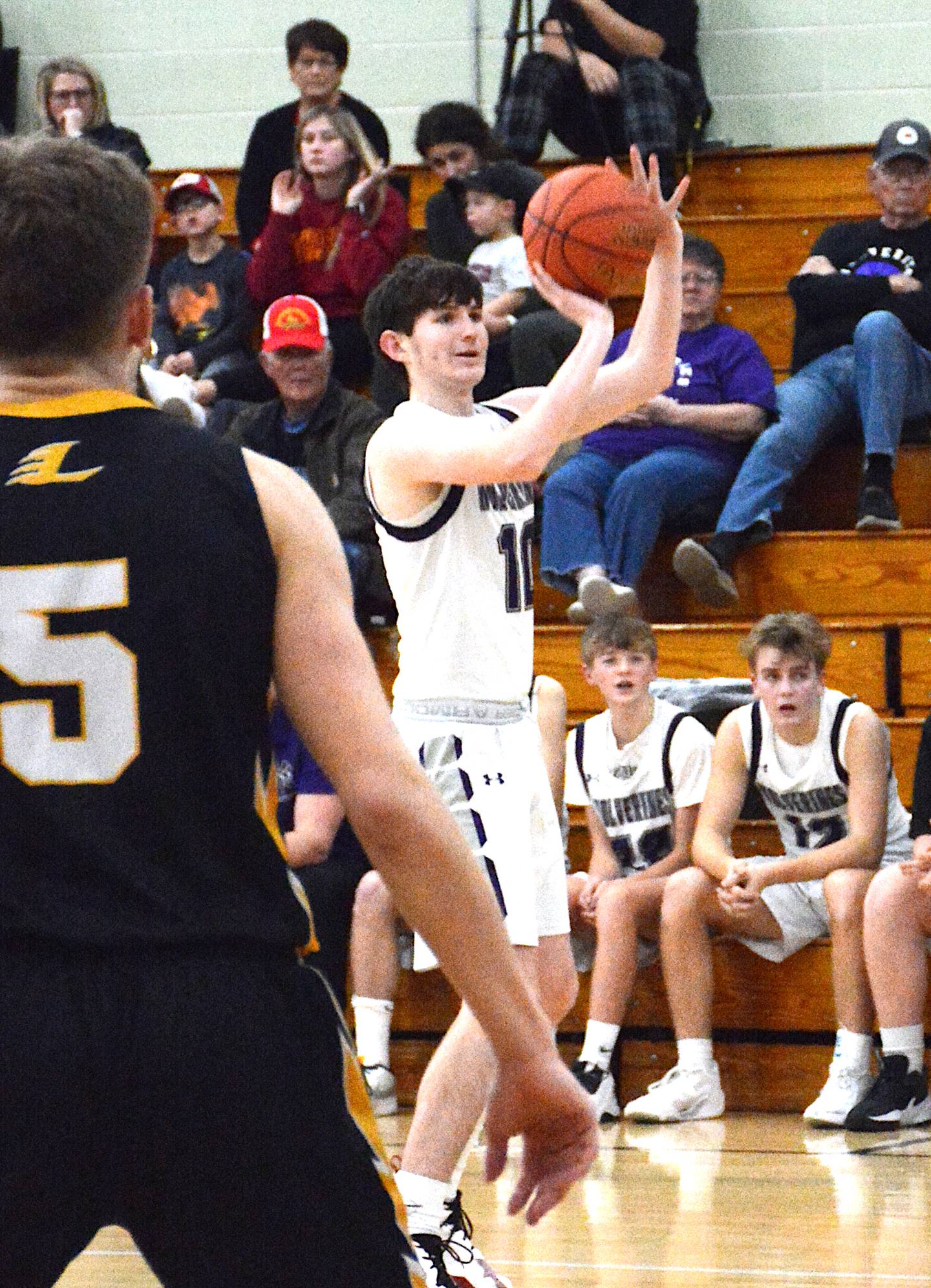 Nodaway Valley/OM senior Jacob Mangels shoots from long range against Lenox in a recent game at Greenfield. Mangels connected for five 3-pointers in that game.