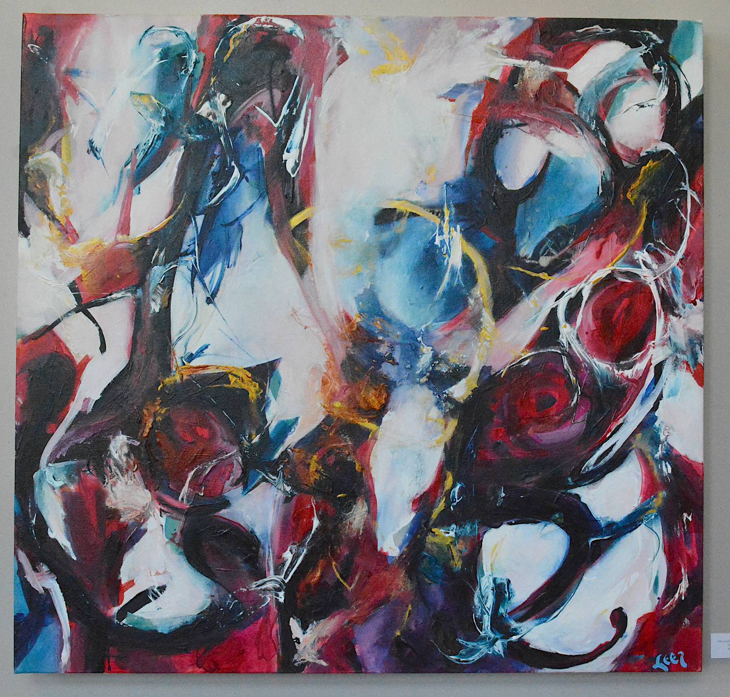 "Take a Left at the Donkey" shows contrast between the colors of the canvas and the abstract shapes which are a large part of Leer's work.