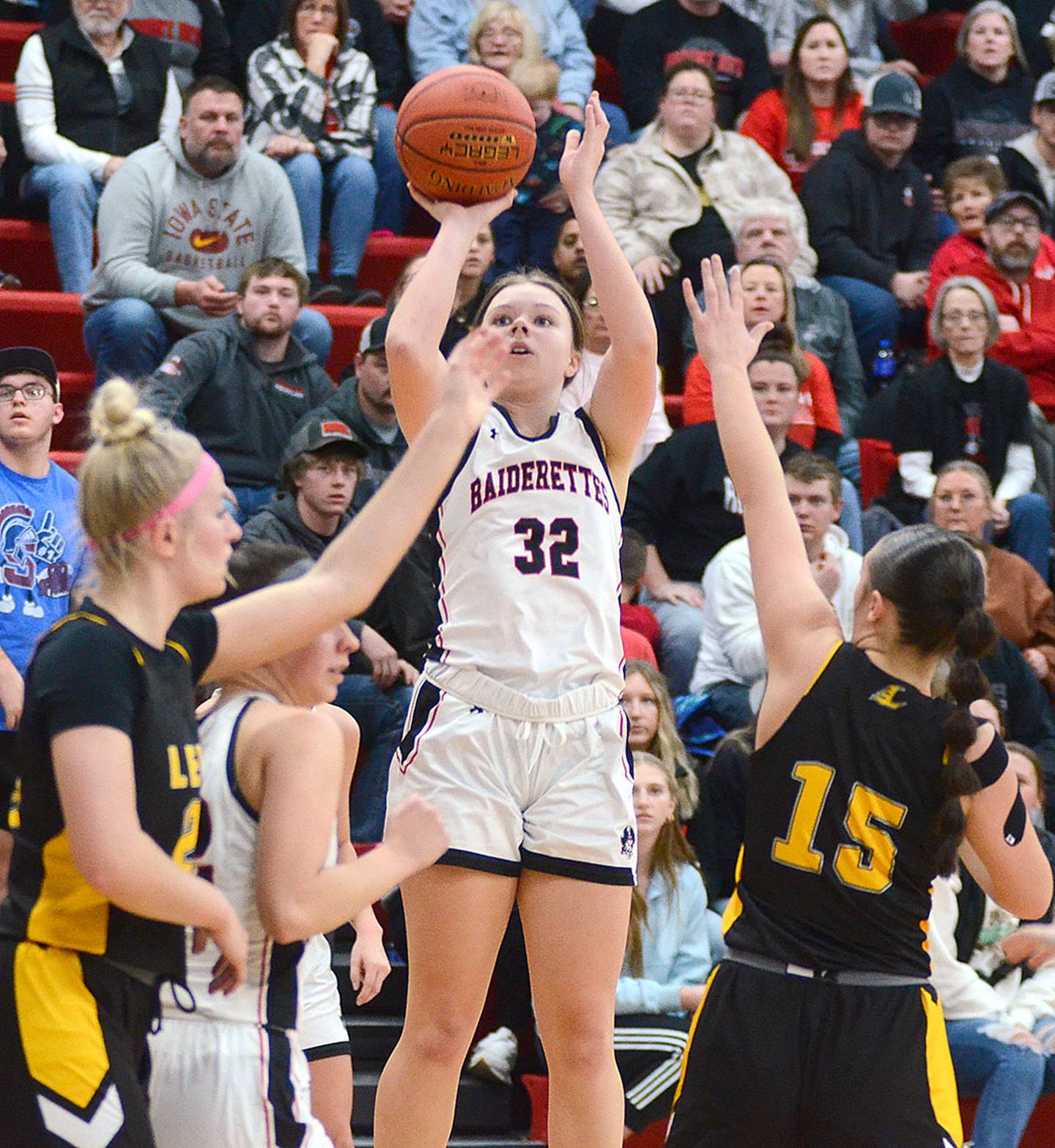 Mount Ayr's Izzy Gilbertson shoots against  Lenox defenders Sadie Cox (left) and Izzy Curtis (15). Gilbertson scored a game-high 16 points in the third meeting of the Pride of Iowa Conference rivals.