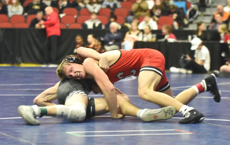 Austin Evans earns a takedown on Ashton Moreno of Algona in the blood rounds. Evans won the bout 5-0 and went on to take seventh at 144.
