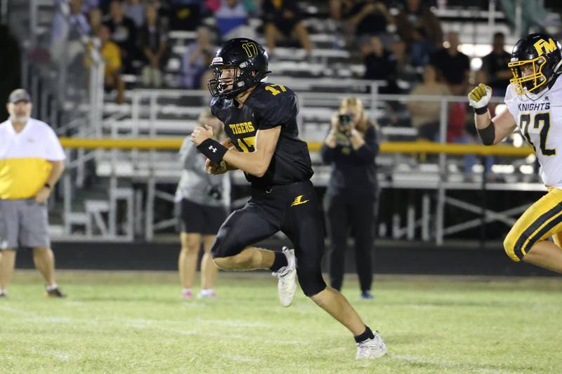 Lenox quarterback Gabe Funk sprints 64-yards to the end zone in the first minute of the 3rd quarter in Friday night's win over Fremont-Mills.  Funk rushed for 125 yards and 3 touchdowns and also completed 8 passes for 132 yards and 2 touchdowns.