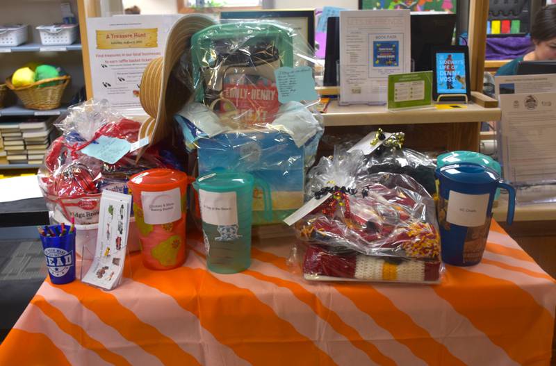 Some of the baskets available to win by raffle for the library's treasure hunt are on display.